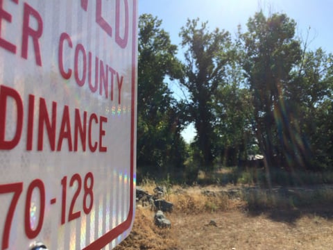 A no-camping sign in Sutter County, Calif.